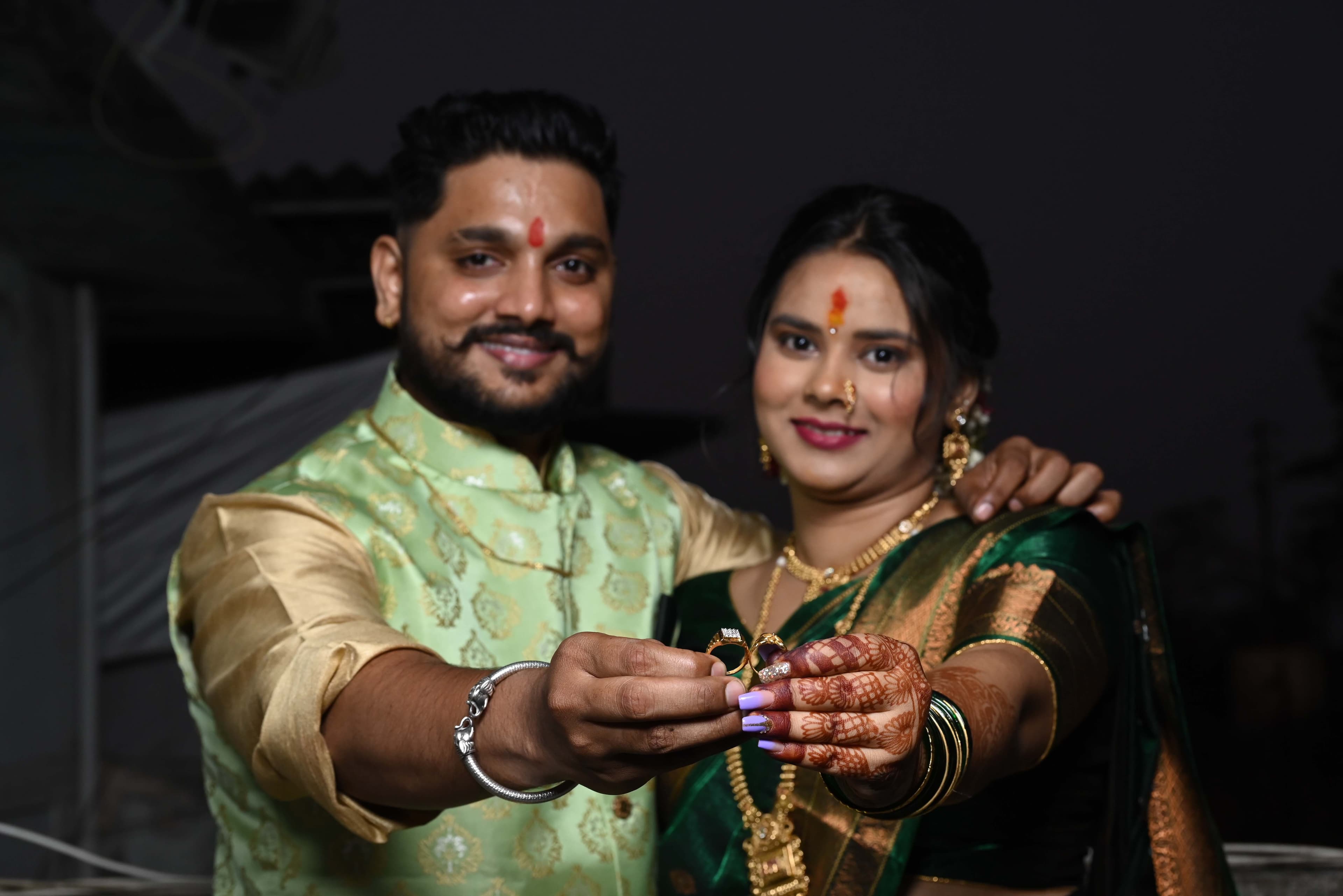 Wedding Photography - Groom and Bride showing their engagement rings